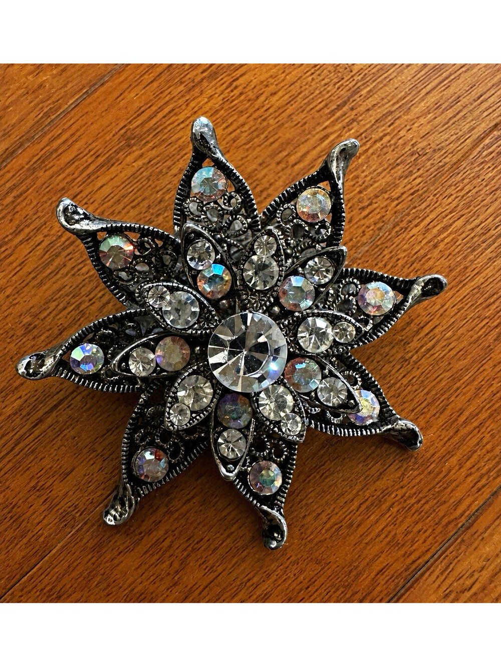 Silver-Tone Star Brooch Pin with Clear Crystal Rhinestone Cluster, Black Metal